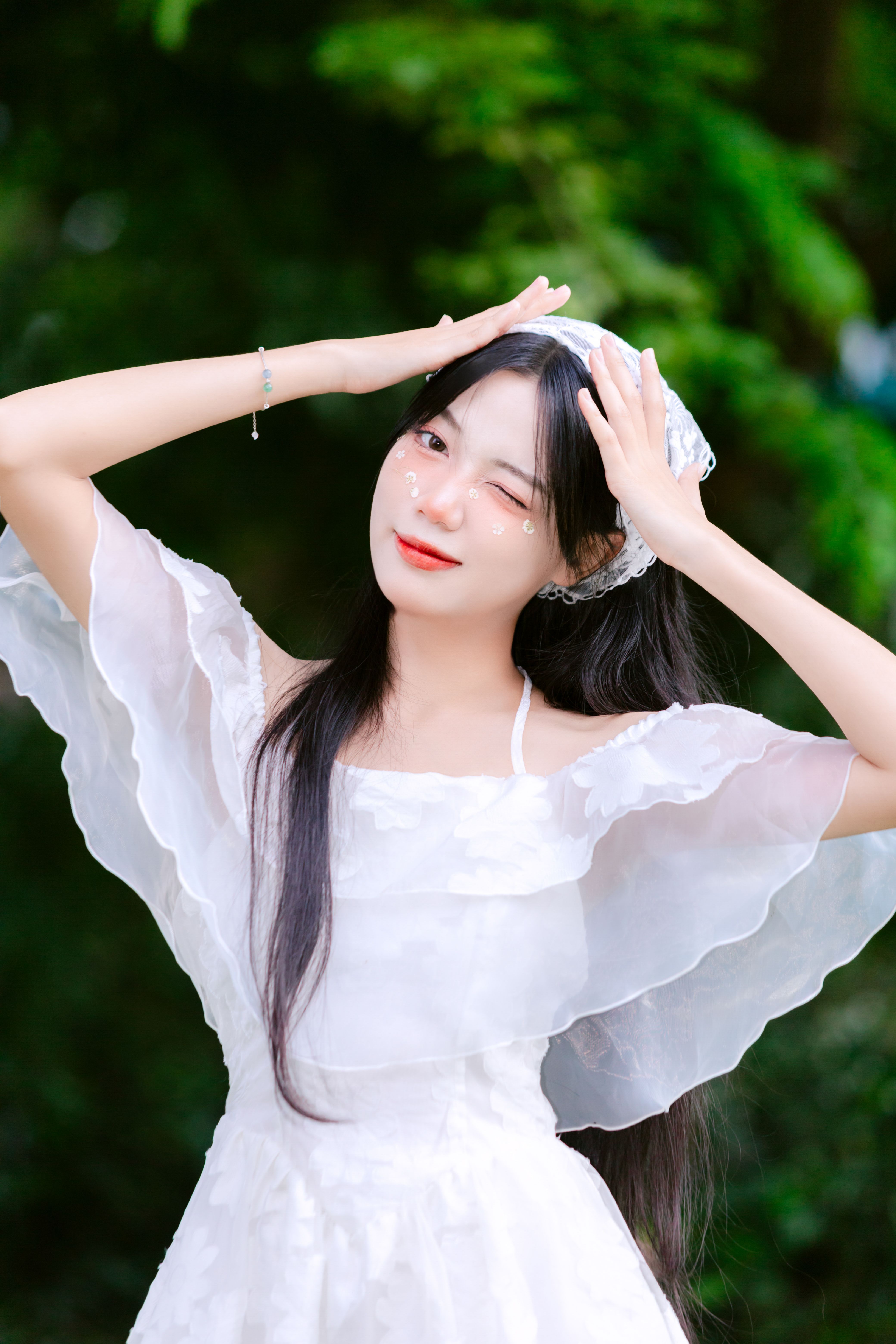 A woman in a white dress is posing for a photo · Free Stock Photo