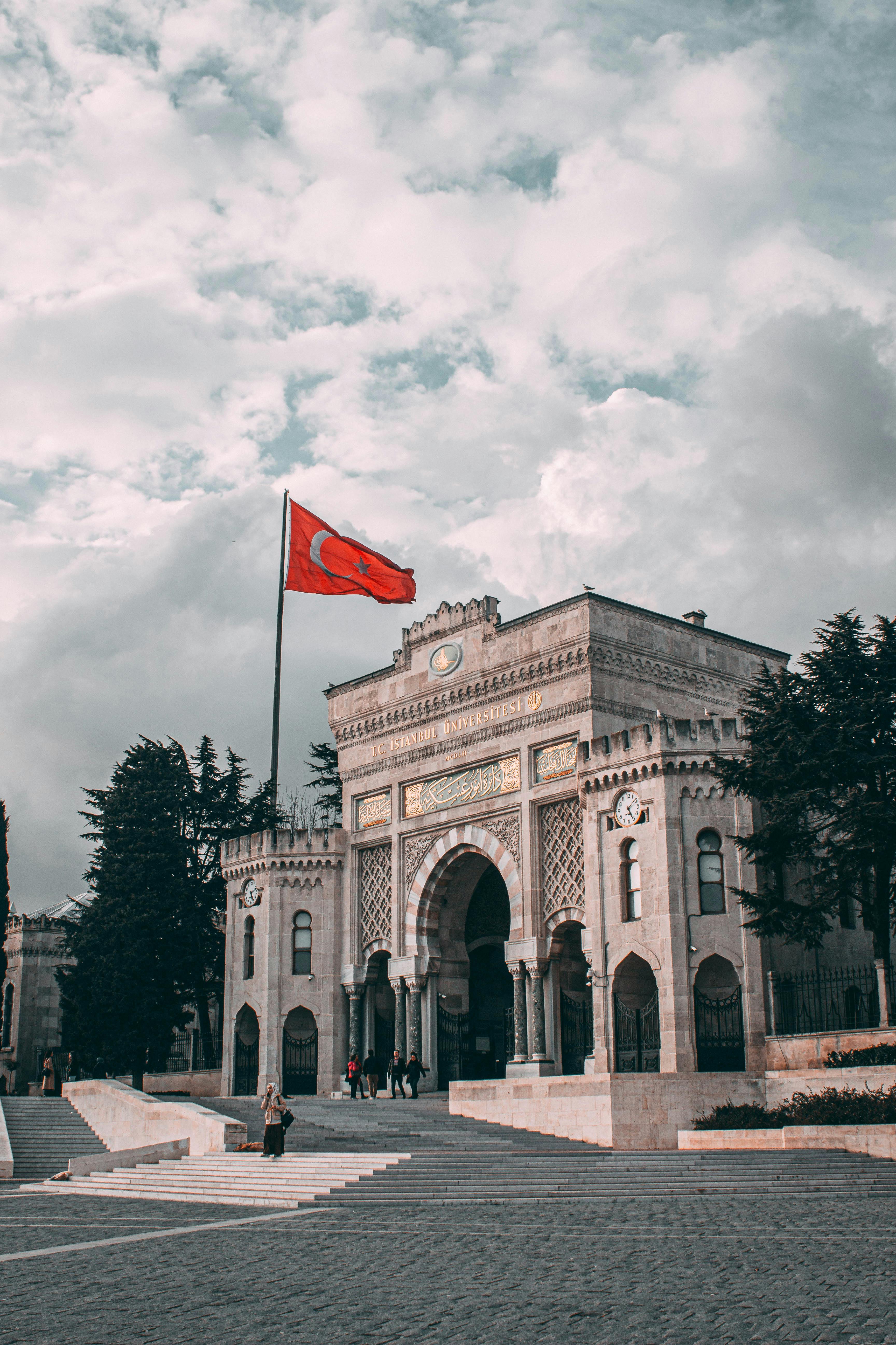 a large building with a flag flying in the air