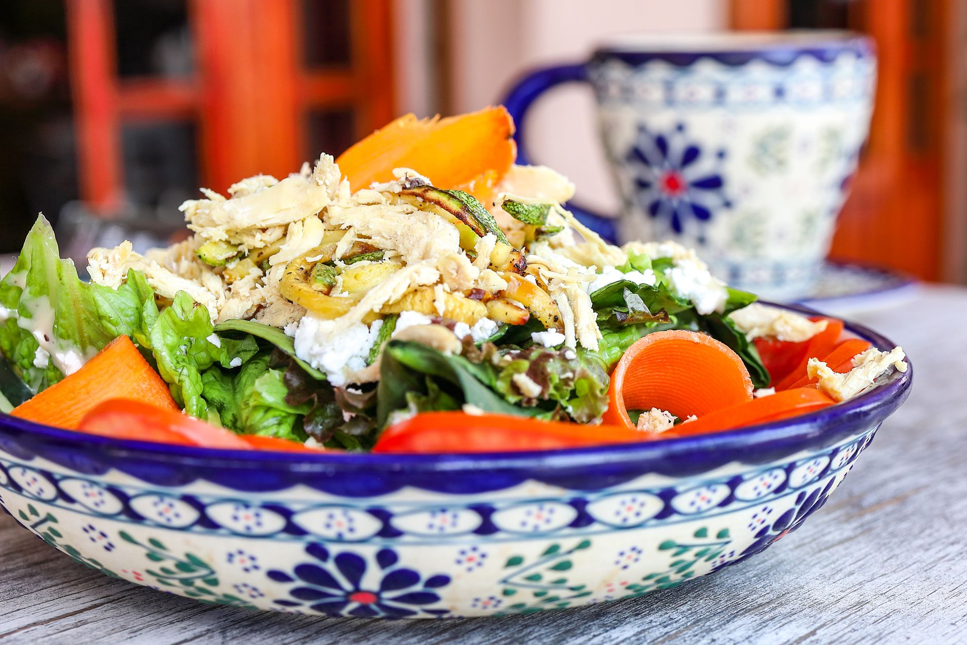 Close-up of roasted root vegetable salad with creamy goat cheese