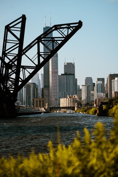 Free Stunning view of the Chicago skyline with iconic bridge over the flowing river. Stock Photo