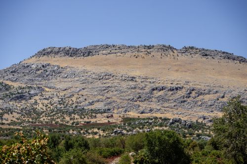 Free Beautiful rocky hills with sparse greenery in Çermik, Diyarbakır, Turkey under a clear blue sky. Stock Photo