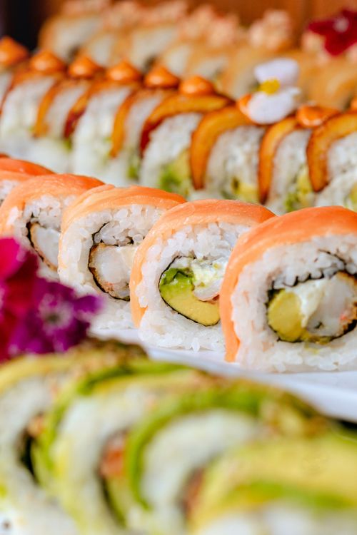 Free Delicious assortment of sushi rolls with salmon, avocado, and fresh toppings. Stock Photo