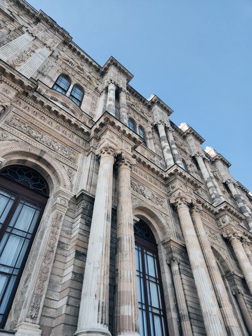 Free Explore the intricate architecture of Dolmabahçe Palace in İstanbul, featuring grand columns and detailed stonework. Stock Photo