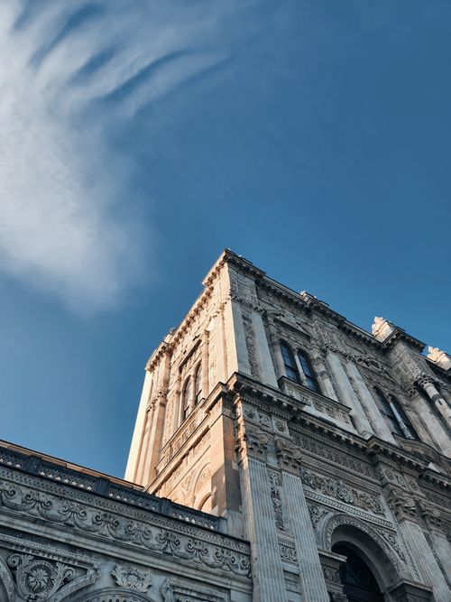 Free Tall Gothic building against a clear blue sky in İstanbul, Türkiye, showcasing ornate details. Stock Photo