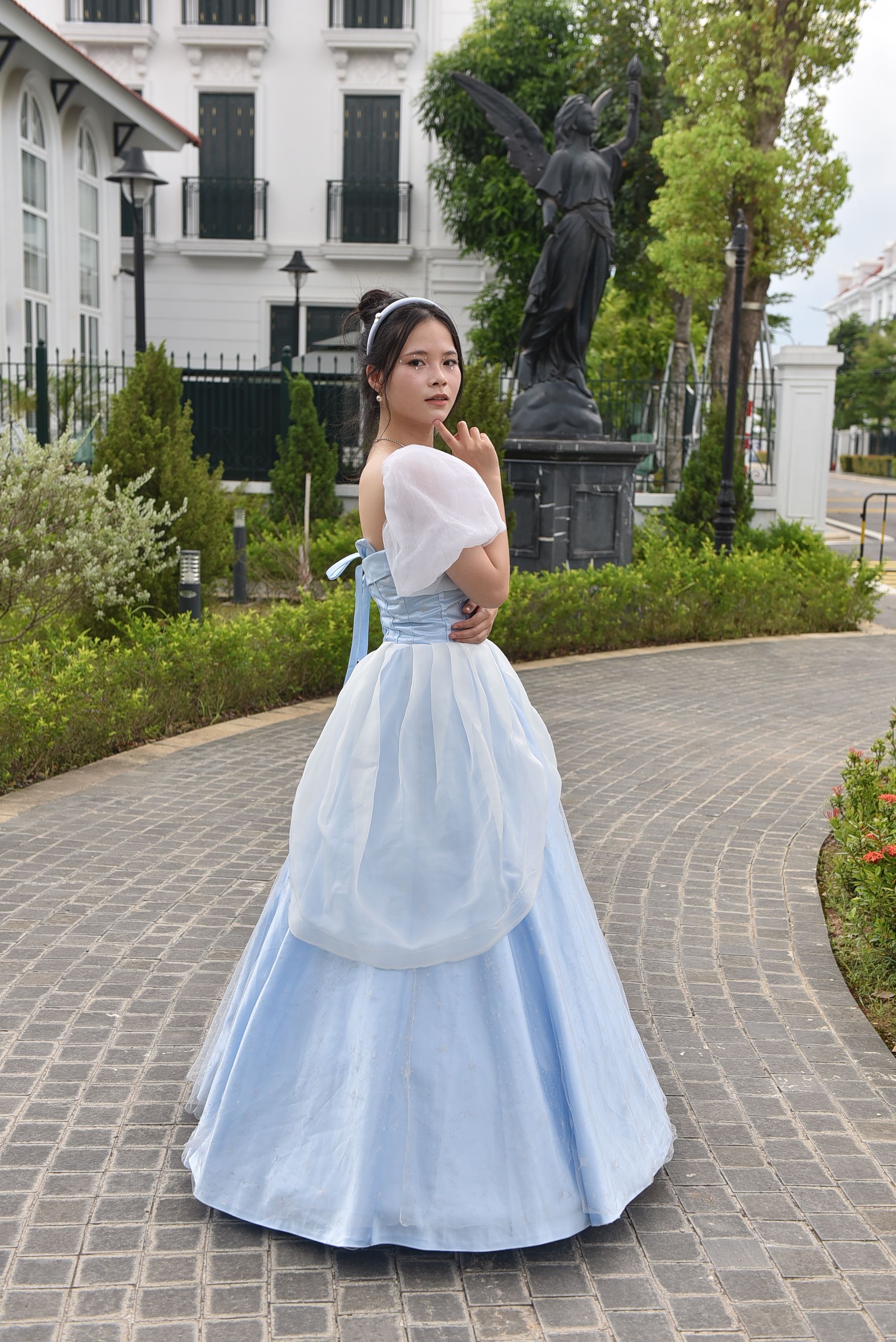 A woman in a blue dress posing for a picture · Free Stock Photo