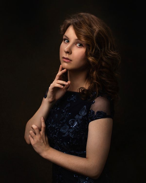 woman in navy lace midi dress