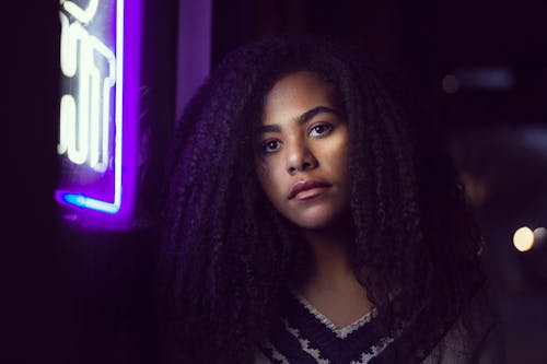 Woman Standing Near Neon Signage