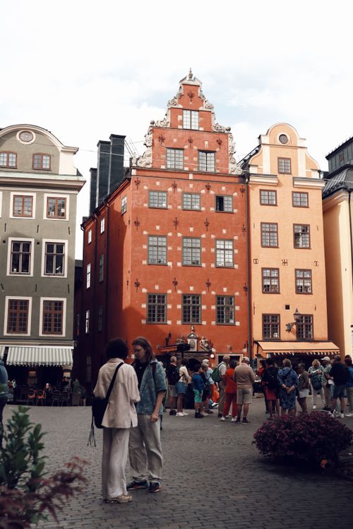 Free Vibrant architecture and bustling streets of Stockholm's charming Gamla Stan. Stock Photo