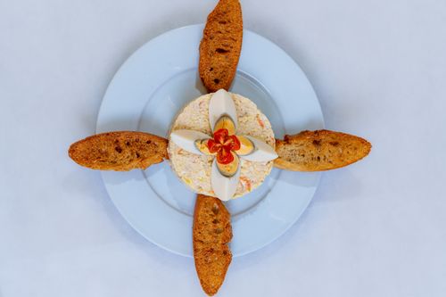 Free Stylish food presentation featuring bread slices and boiled eggs on a plate. Stock Photo