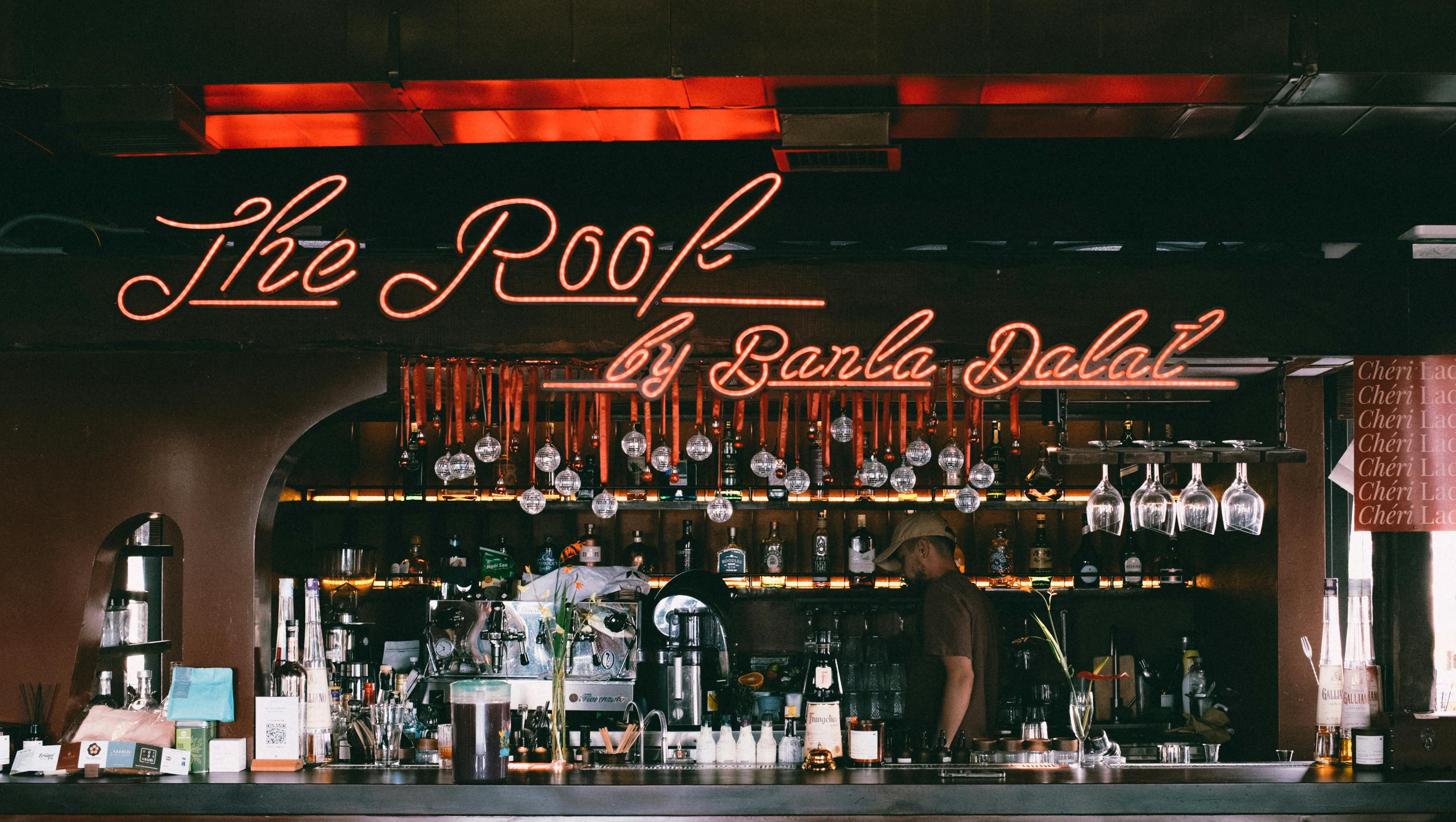 the roof bar a bar with neon signs