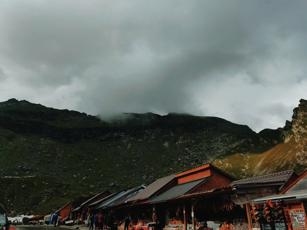 Man relaxing on a sofa in the evening with a book instead of using a smartphone