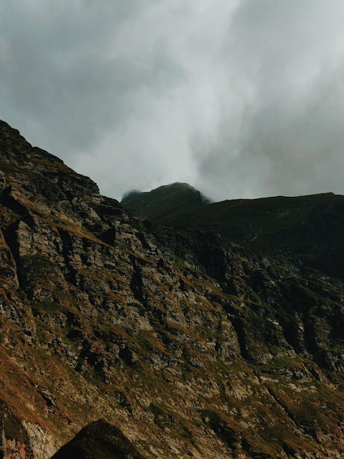 Black and Brown Mountains Under White Sky