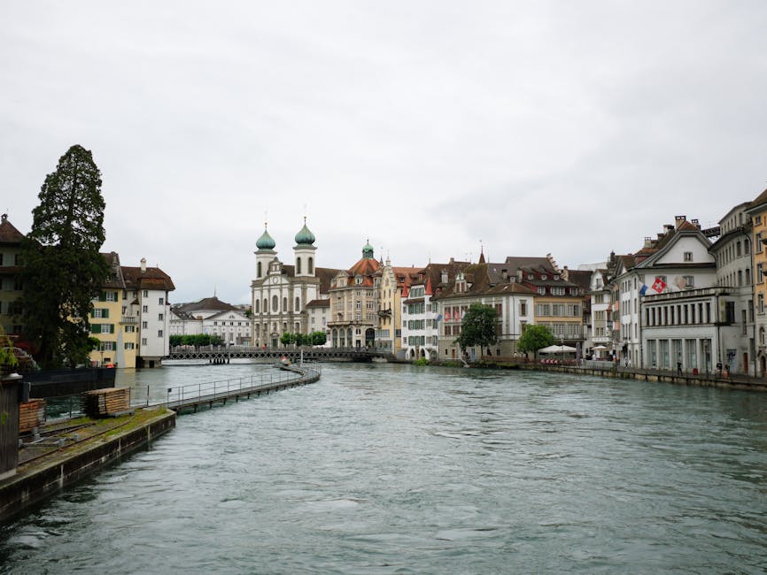 Scenic view of Luzern cityscape featuring historic architecture along the Reuss River. in Lucerne