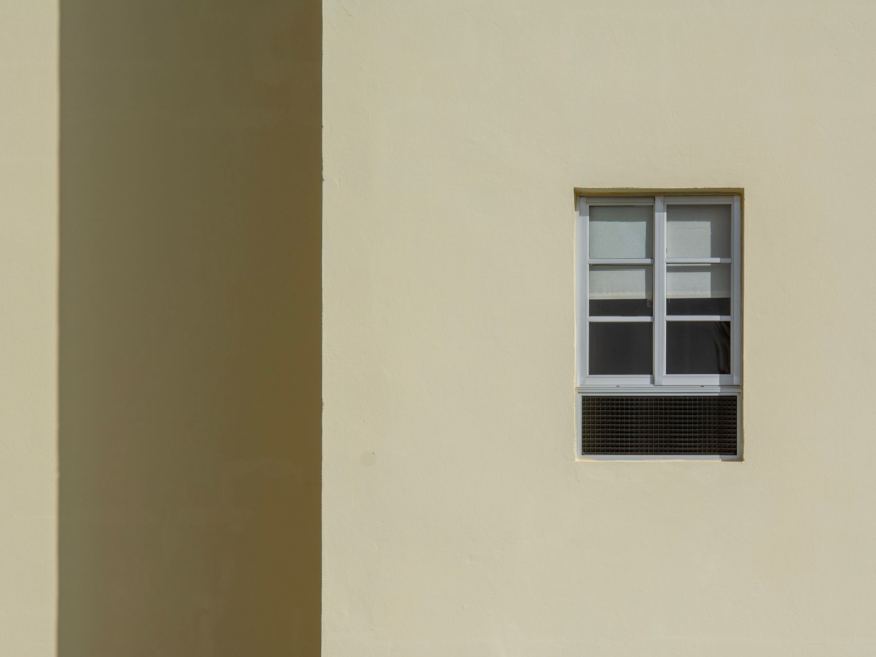 Masonry and Render Painting in Brixton — a decorator at work mid-project