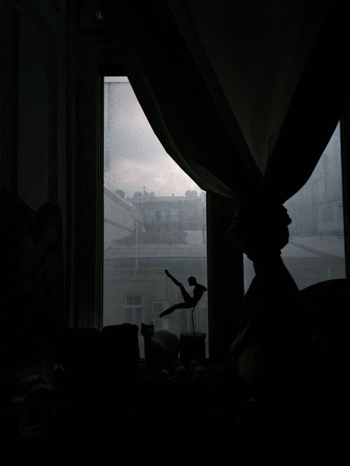 Free Moody silhouette of a ballet dancer figurine by a curtained window with soft natural light. Stock Photo