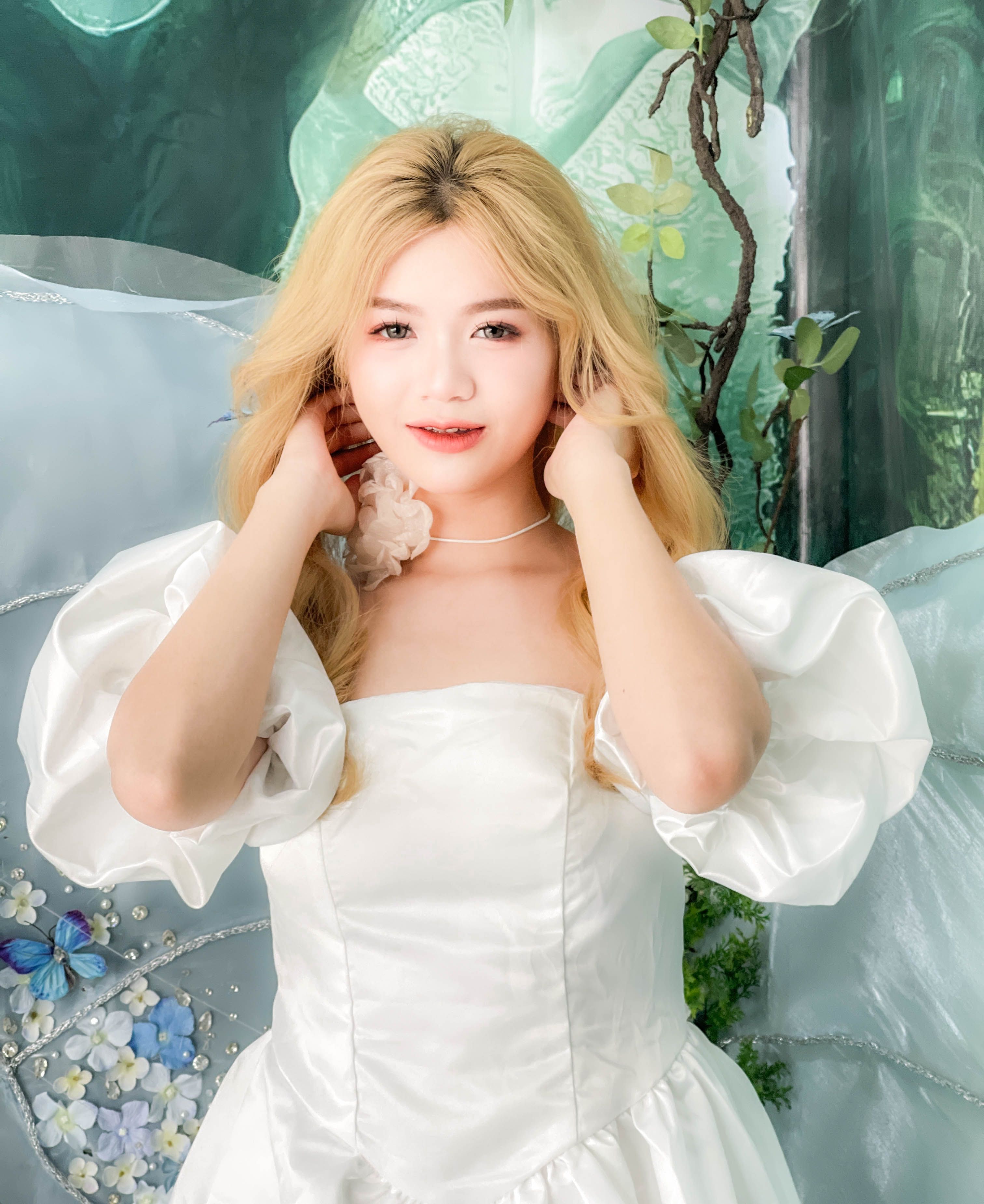 A woman in a white dress posing for a photo · Free Stock Photo