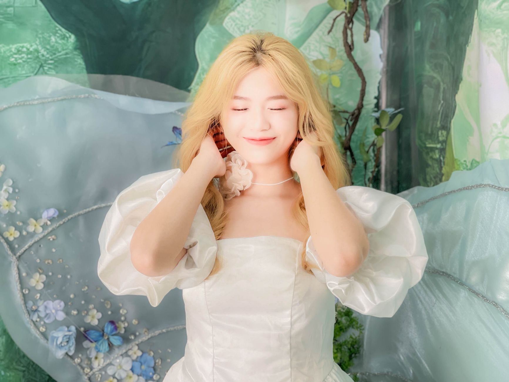 Enchanting bridal portrait featuring a woman in an elegant, fairy-tale gown with soft lighting.