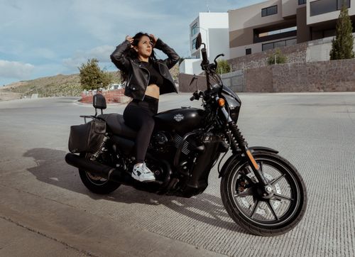 Free A confident woman poses elegantly on a motorcycle in San Luis Potosí, Mexico. Stock Photo