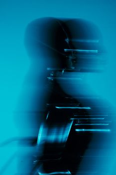 A dynamic abstract silhouette with a futuristic feel in cool blue lighting.