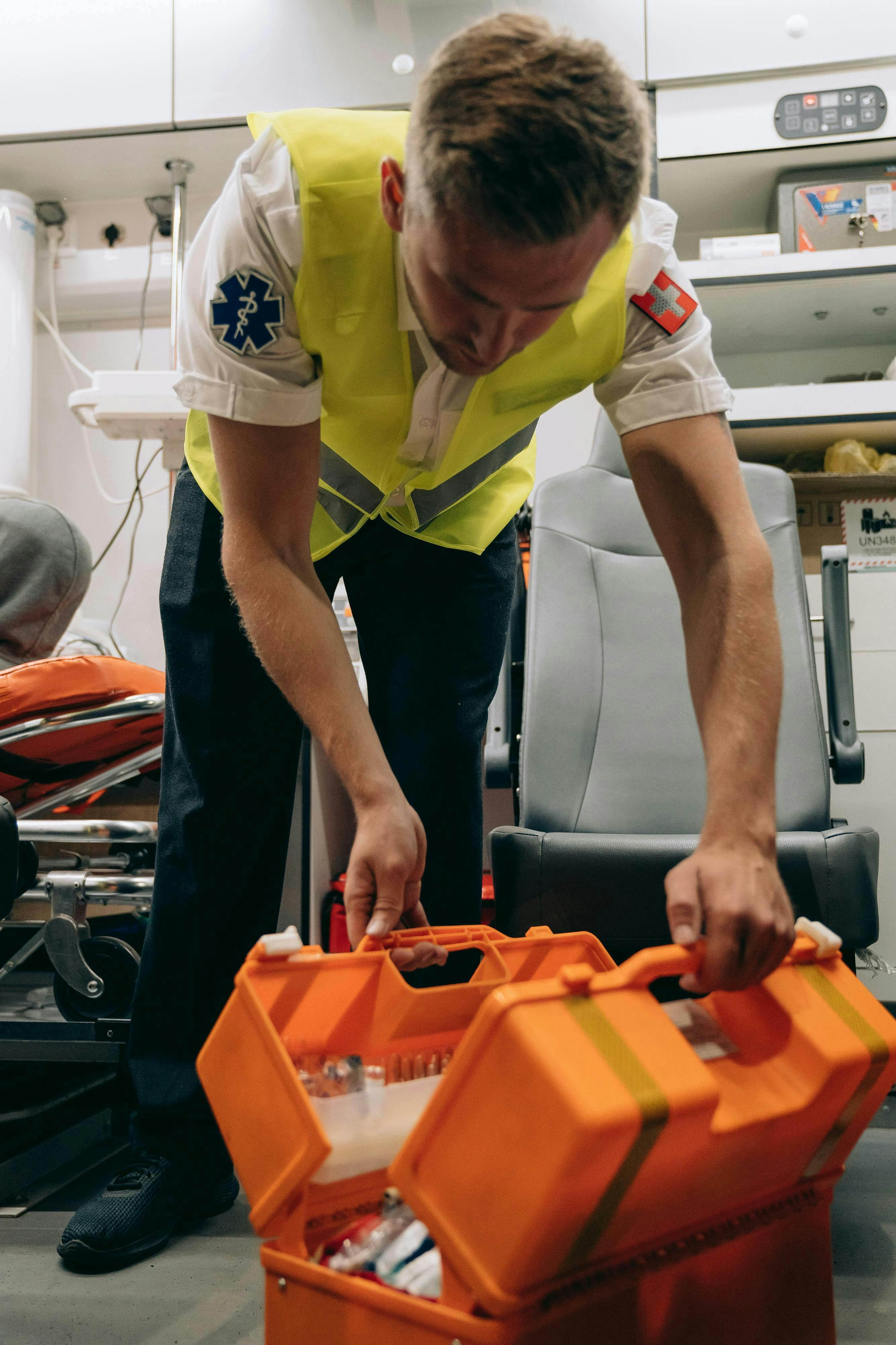 paramedic looking into aid hard suitacse