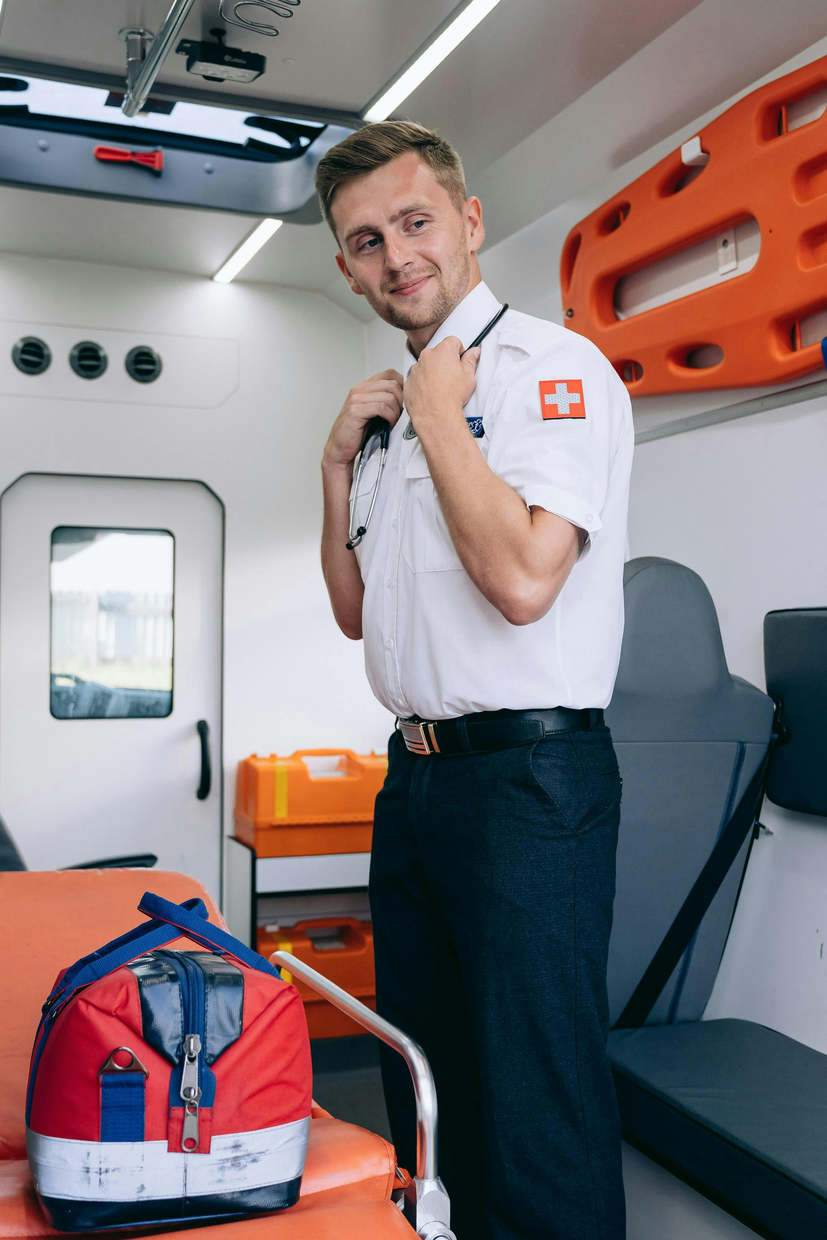 serene paramedic standing in ambulance