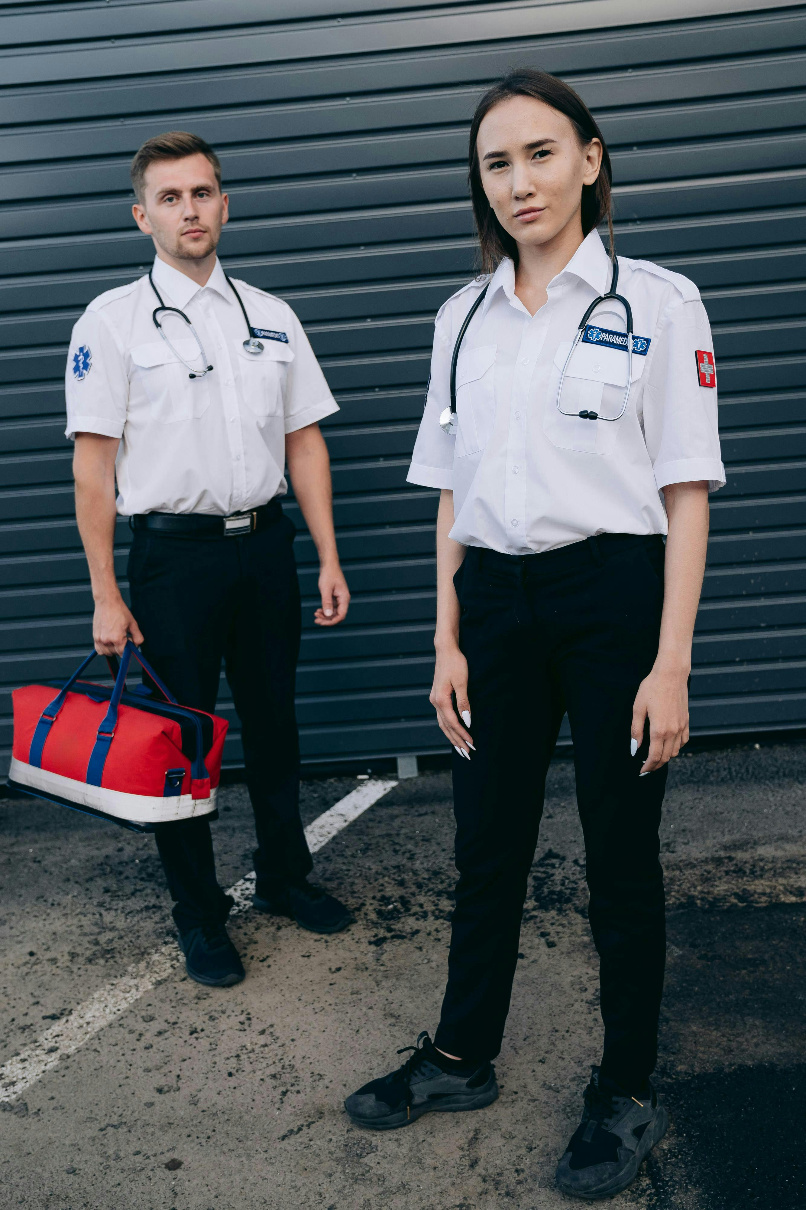 standing paramedics in uniforms