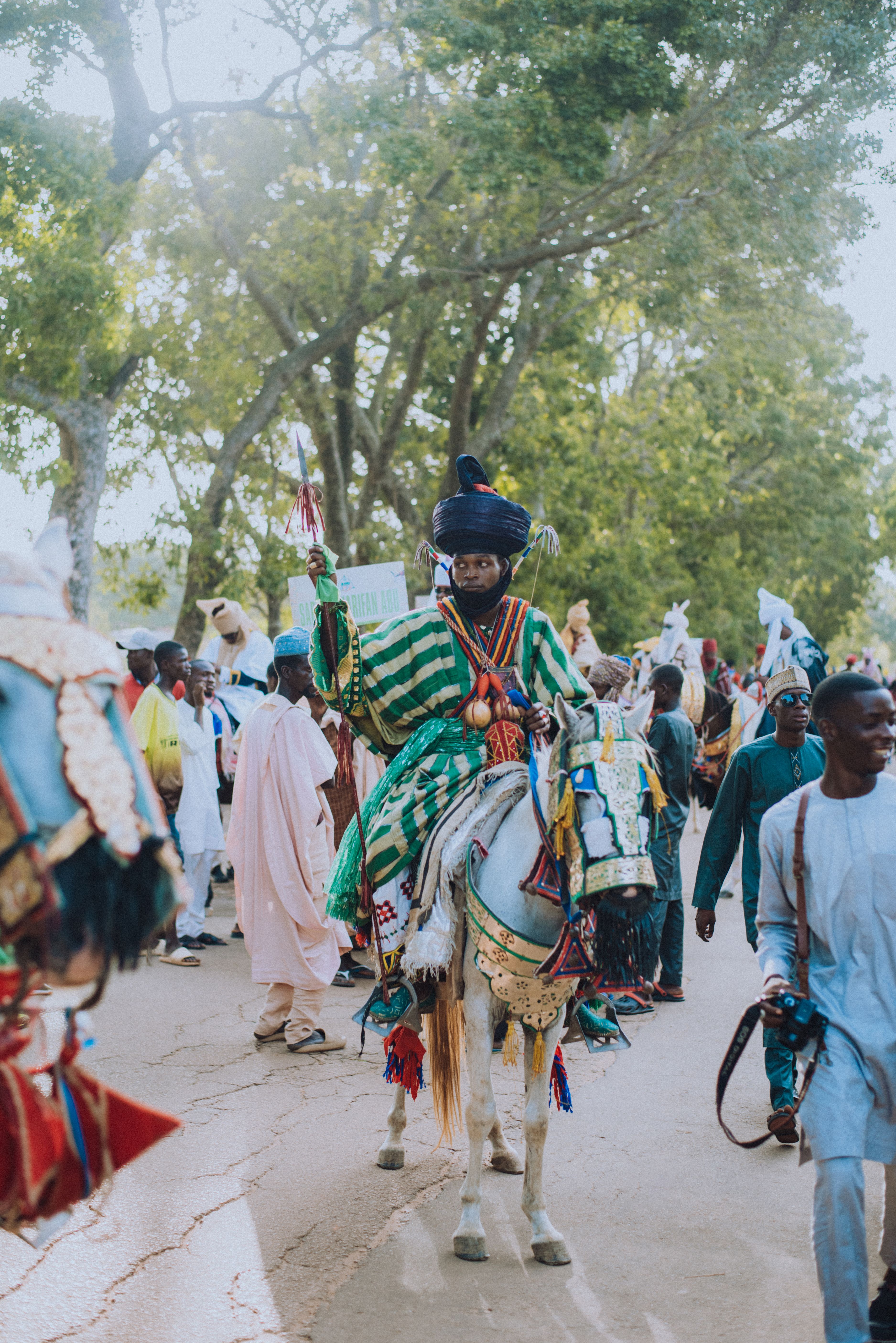 A man in a traditional costume riding a horse · Free Stock Photo