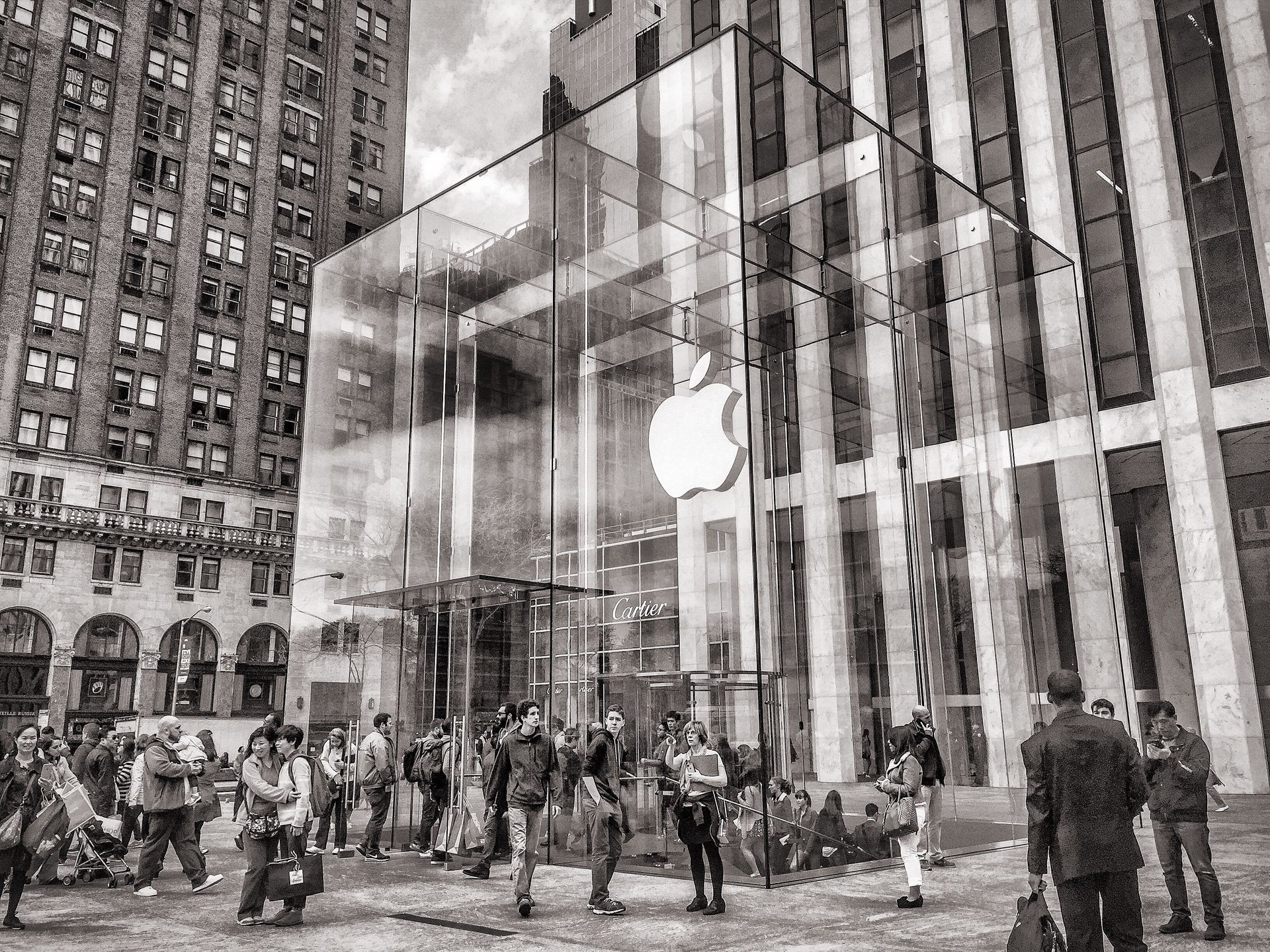 The iconic glass-cube entrance of the Apple store in Manhattan in evening light