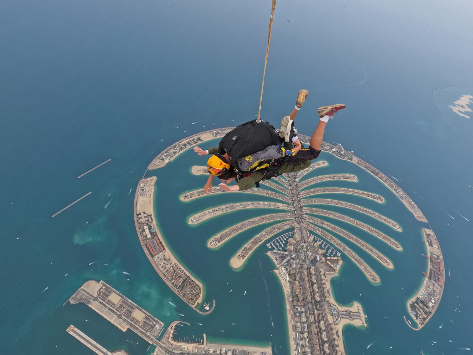 Tandem skydiver above Palm Jumeirah, Dubai