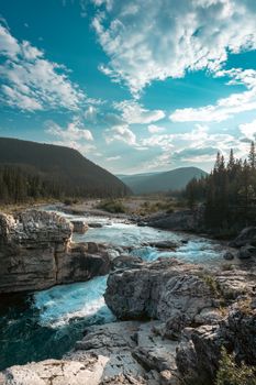 Stunning view of Kananaskis River and Rocky Mountains in summer.