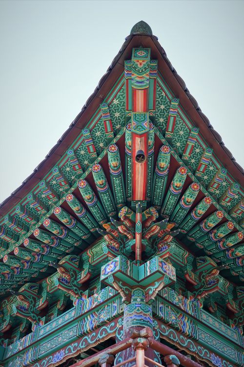 Free Colorful ornate wooden pavilion showcasing traditional architecture against a clear sky. Stock Photo