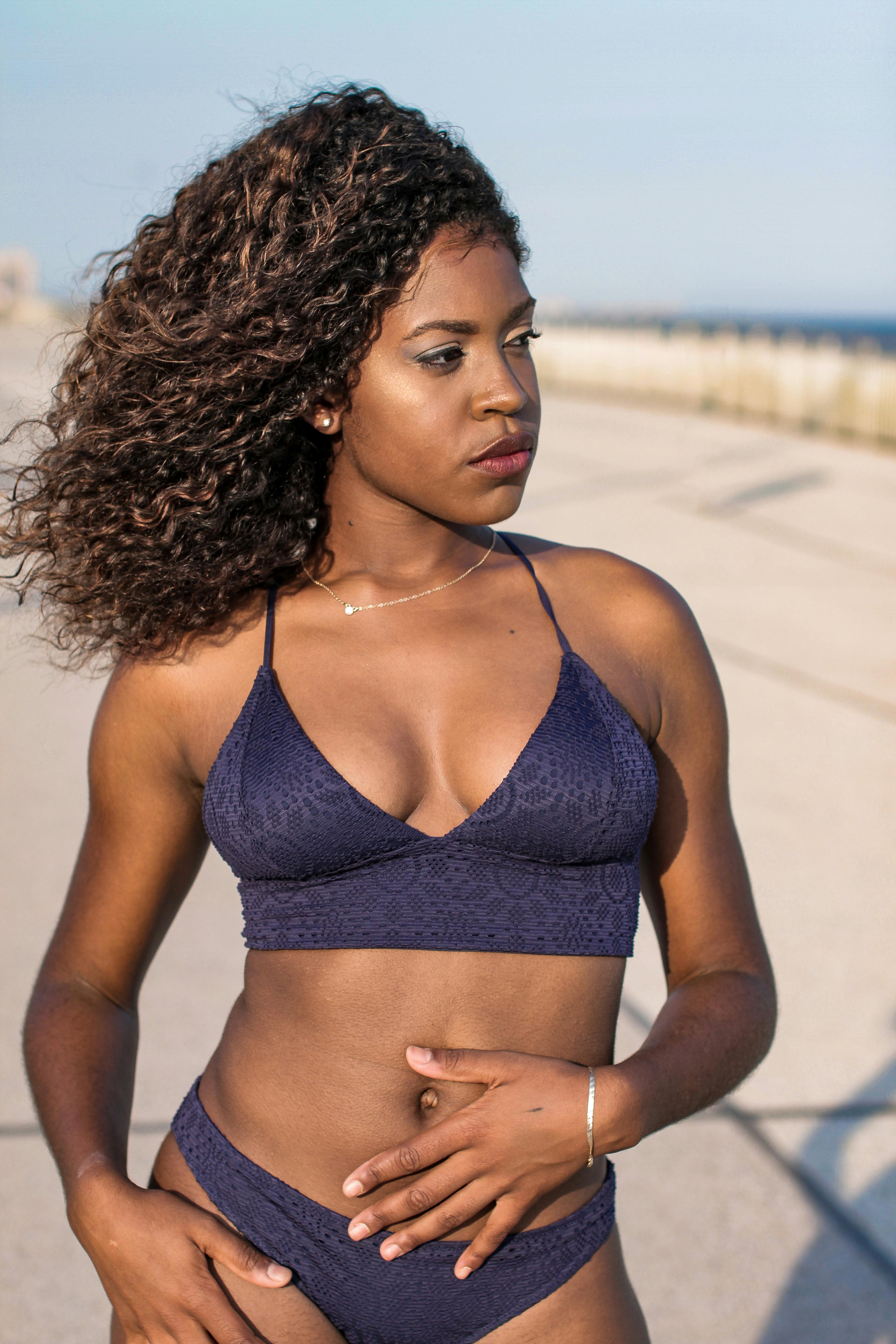 woman wearing purple swimsuit