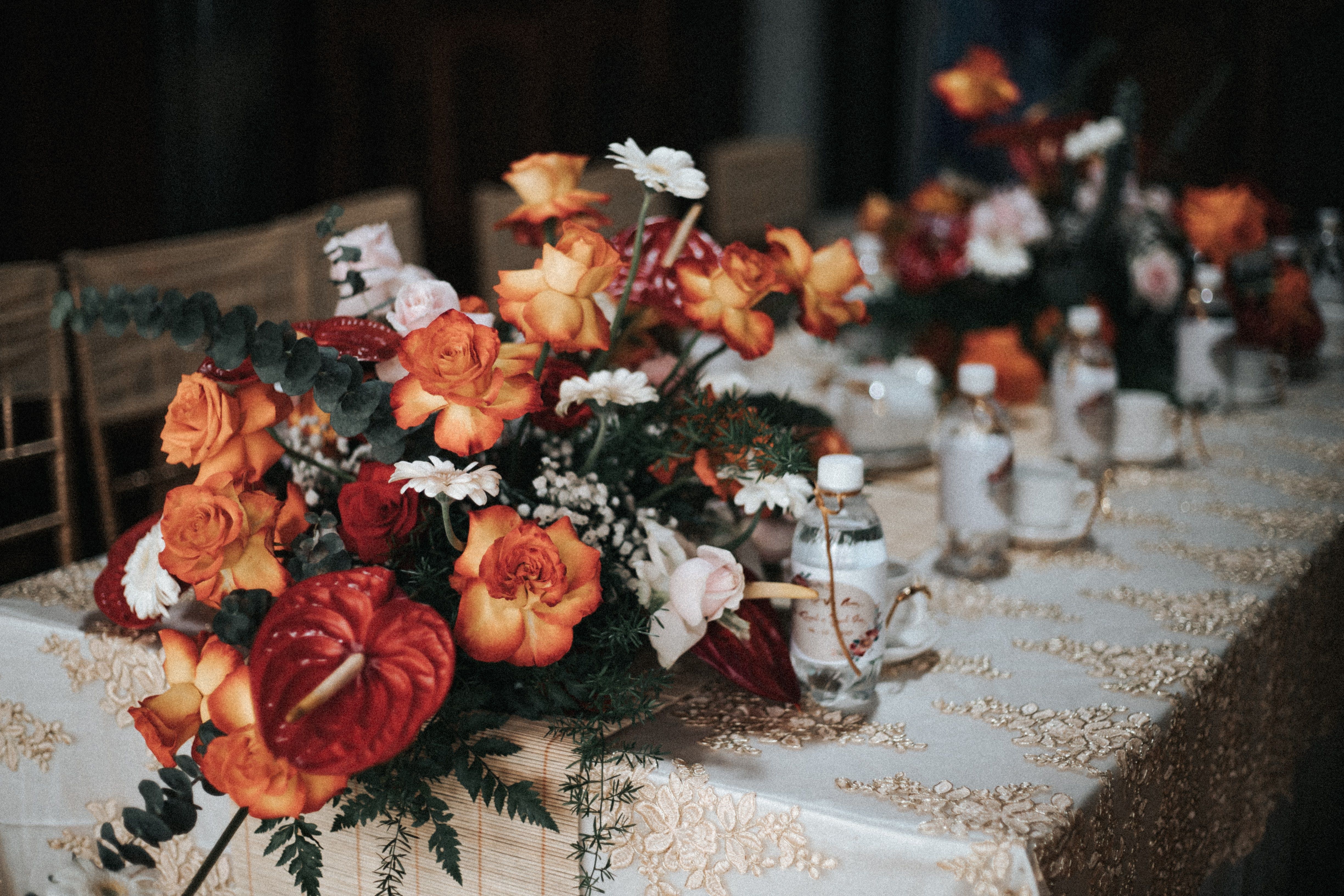 Beautiful table setup with vibrant floral arrangements, perfect for weddings and celebrations.