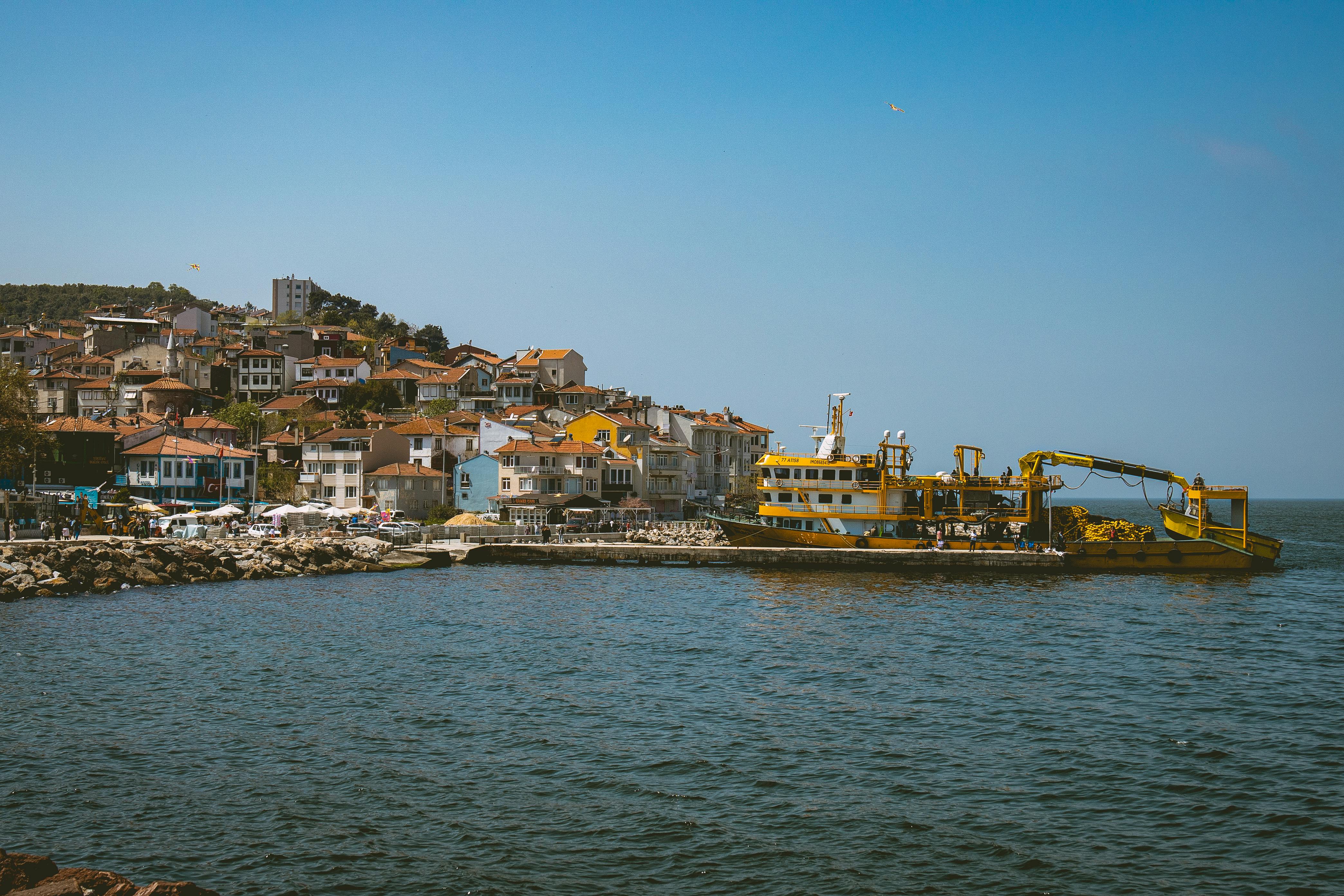 a boat is docked in front of a city