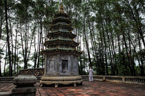 Free Explore the serenity of a traditional pagoda surrounded by lush trees in Hue, Vietnam. Stock Photo