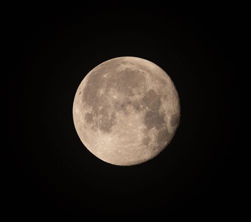 Free Crisp and detailed capture of the full moon against a black night sky, showcasing lunar features. Stock Photo