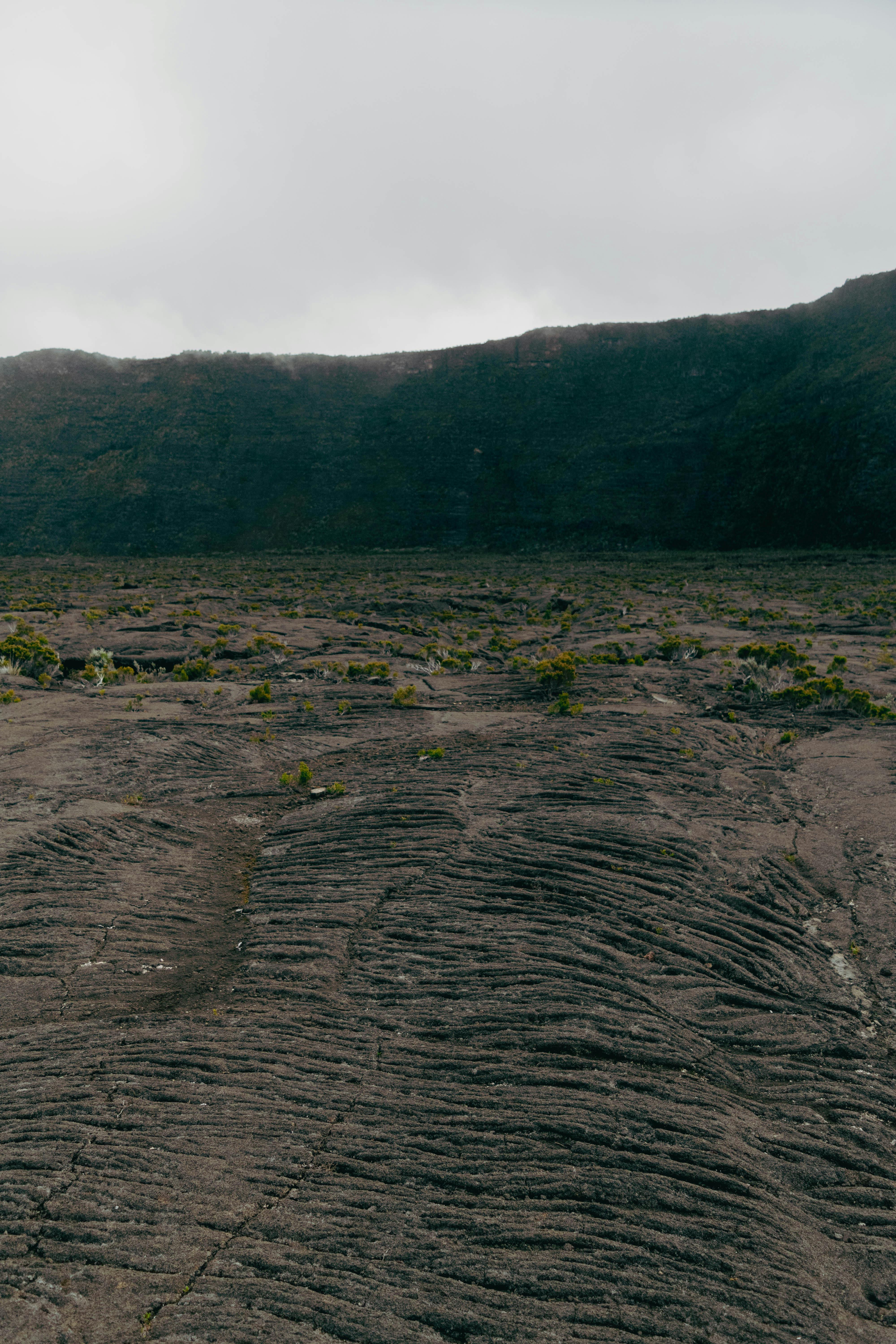 a person standing on a rocky hillside