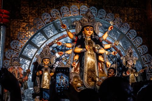 Free Colorful statues of Goddess Durga during Kolkata's famed Durga Puja festival, showcasing rich cultural artistry. Stock Photo