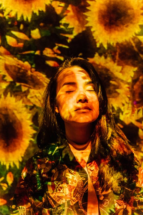 Free Woman Under Sunflower Textile Stock Photo