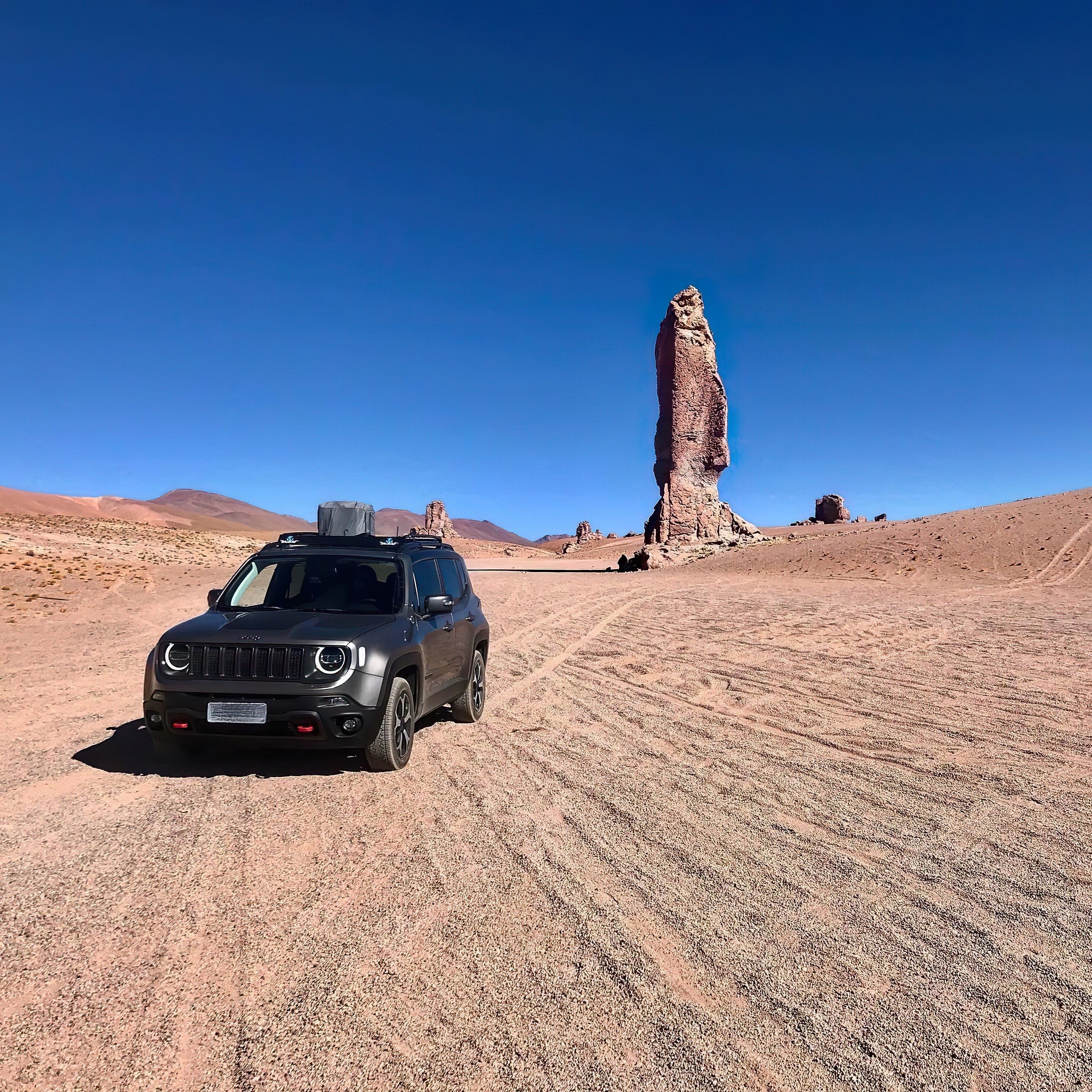 A car parked in the desert with a mountain in the background · Free ...