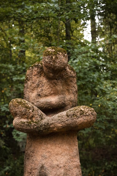Free A tranquil stone sculpture surrounded by lush greenery in a Finnish park, perfect for meditation and contemplation. Stock Photo