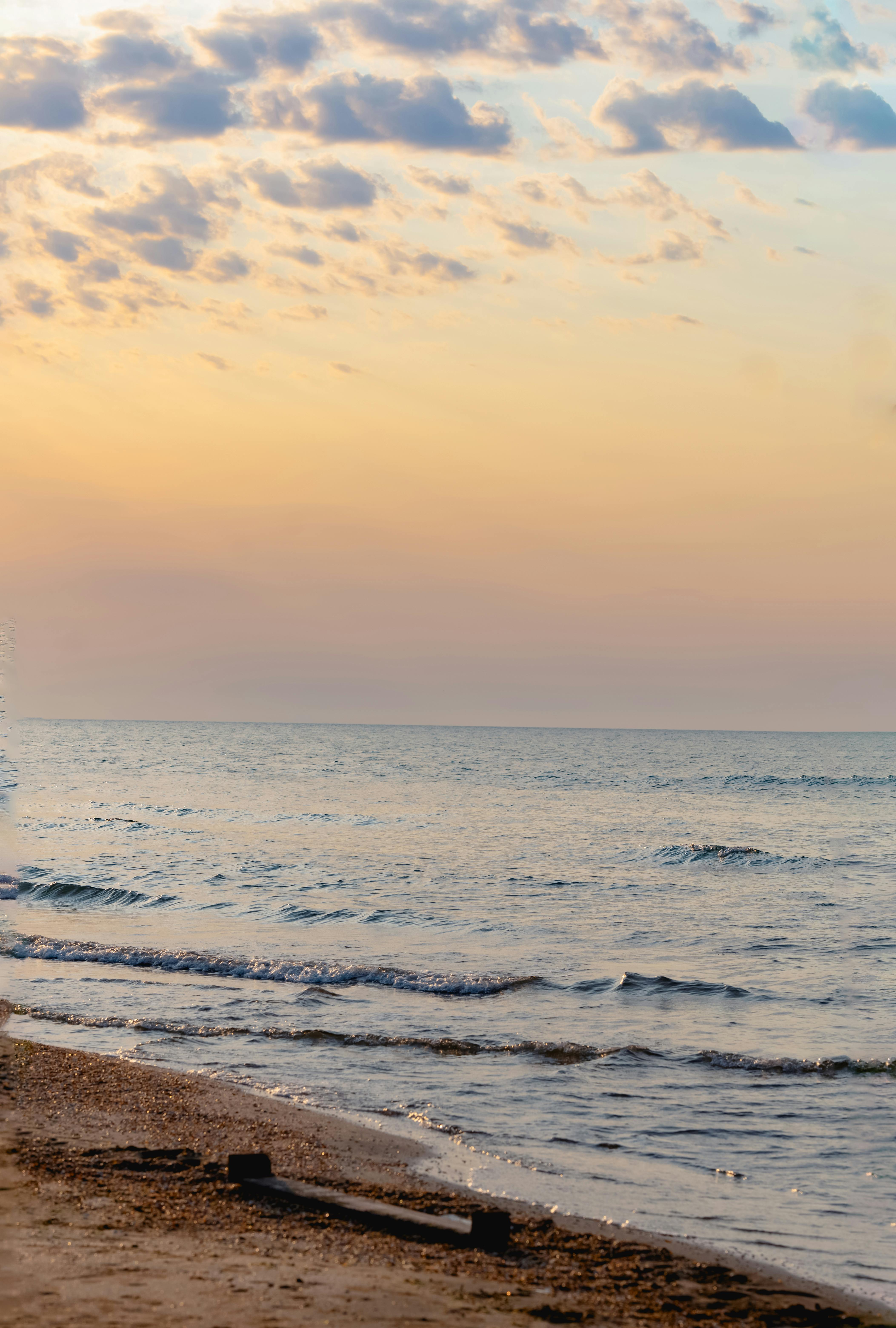 Tranquil coastline of the Caspian Sea in Baku during sunset, offering a peaceful view.