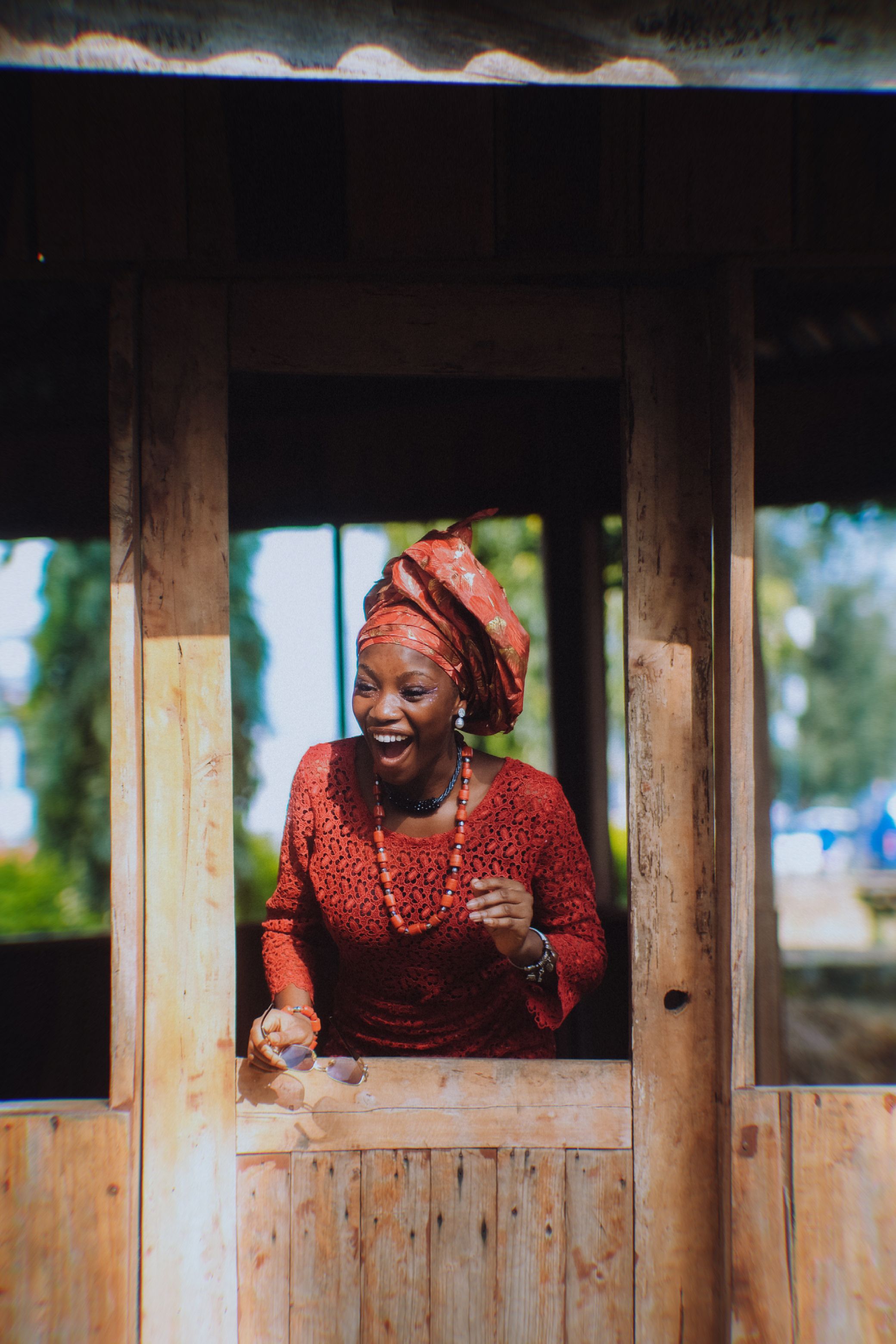 A woman in red dress smiling at the camera · Free Stock Photo
