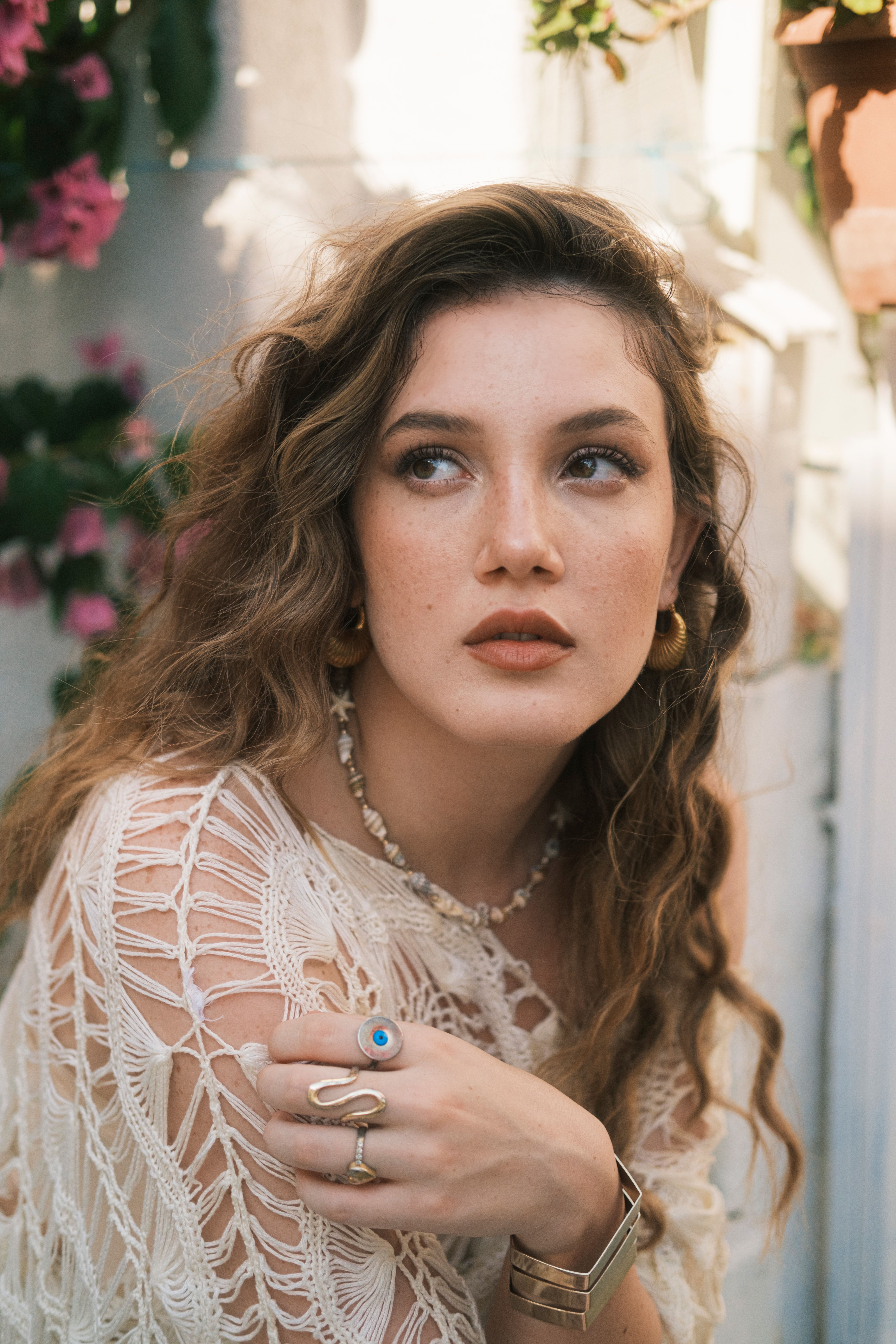 A woman with long hair and a white lace top · Free Stock Photo