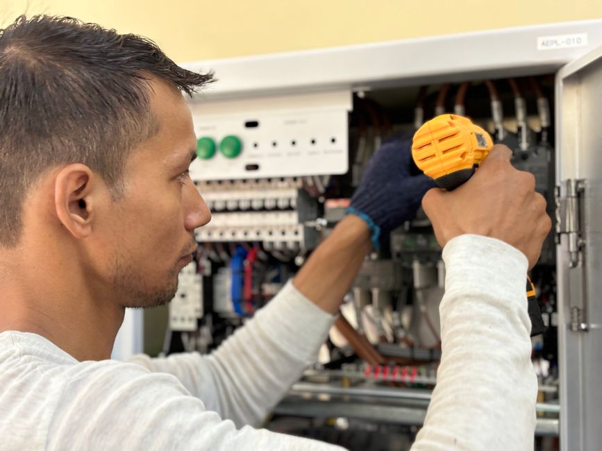 technician performing electrical repairs and building upkeep - building maintenance near me technician performing electrical repairs and building upkeep - building maintenance near me