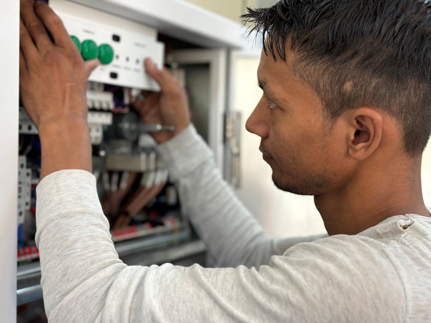 engineer working on an industrial control panel - computer security hardware solutions engineer working on an industrial control panel - computer security hardware solutions