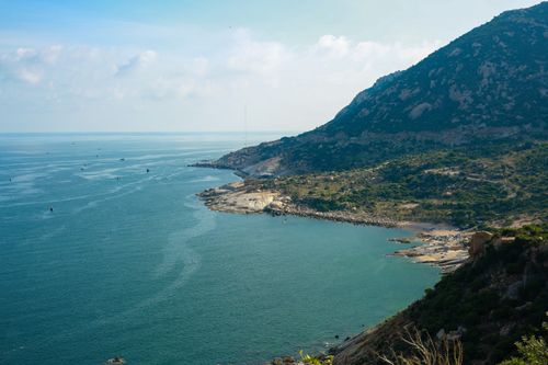 Free Explore the stunning coastline of Phan Rang, Vietnam, with clear blue waters and mountains. Stock Photo