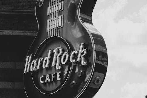 Greyscale Photo of Hard Rock Cafe Signage