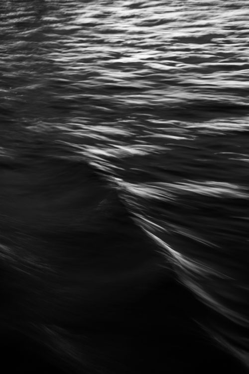 Free Abstract black and white photo capturing flowing water texture, perfect for a dramatic background. Stock Photo