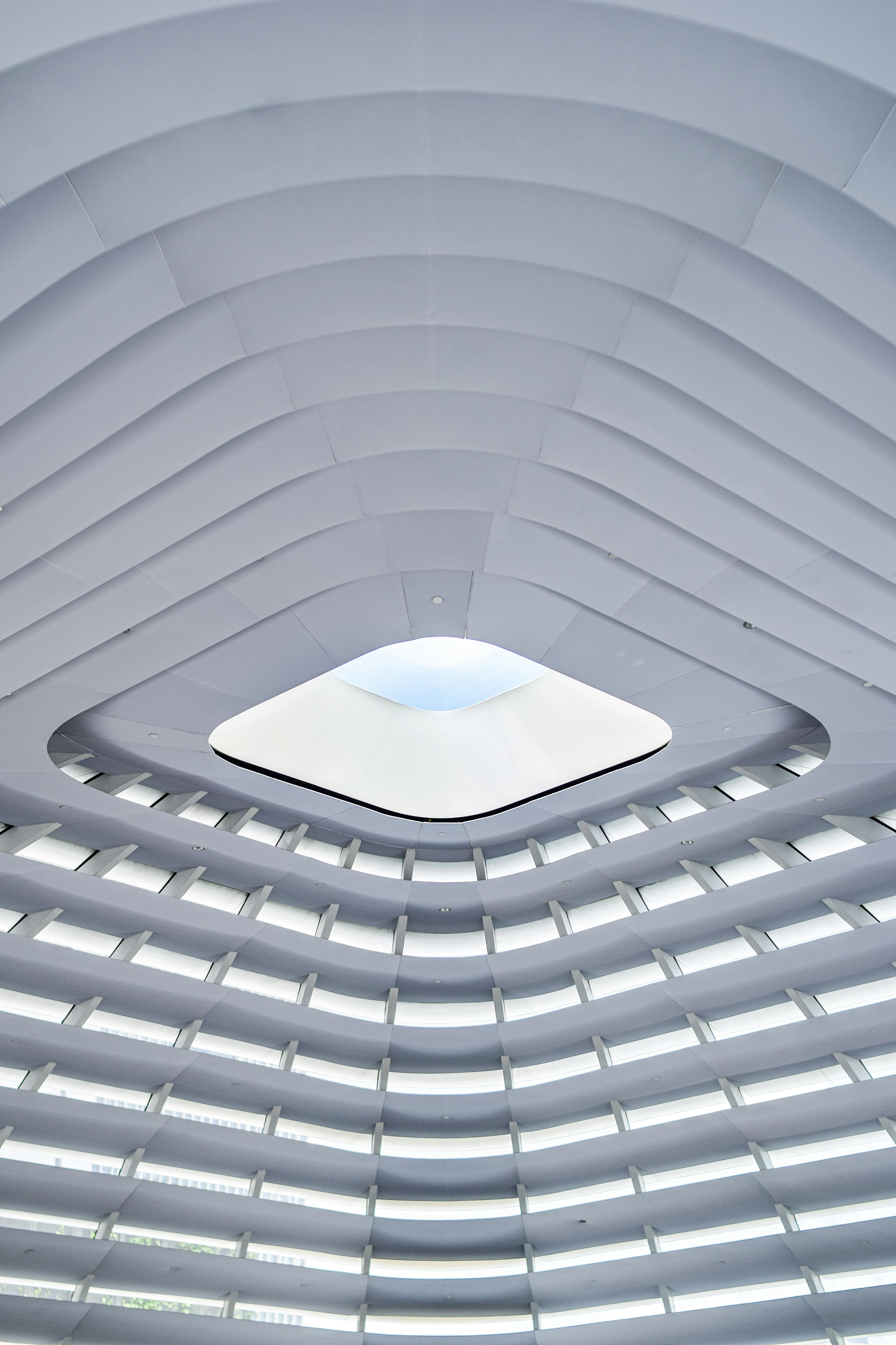 Futuristic interior architecture with a geometric skylight in Kuala Lumpur.